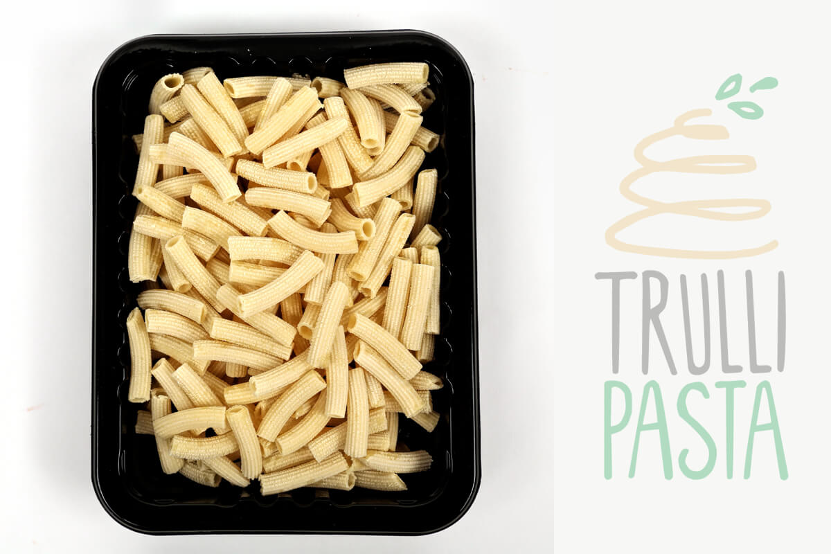 Rigatoni pasta is tubular in shape and loved for its ability to hold sauces and grated cheese on its ridges. It resembles penne but with square-cut ends and often slightly curved. Rigatoni is the favorite pasta shape in the south of Italy and Sicily. It is perfect with any sauce, from cream to the chunkiest meat sauces.