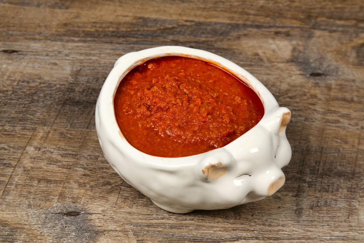 Developing robust flavors takes time, but cooking our traditional bolognese sauce slowly allows each ingredient to stand out while creating the perfect texture. 